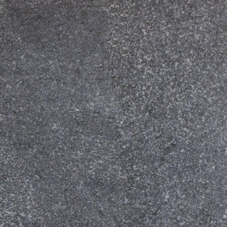 Color/Finish variation image for Jet Mist Granite. The surface finish shown is honed. The dominant color shown is gray; with blue, brown, green and purple secondaries. The color mix creates a cool feeling. Speckled, blotched and cloudy color patterns.