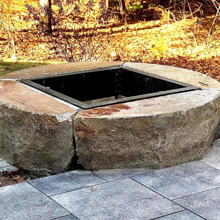 Application image for Reclaimed D-Radius Curbstone. The image shows this material being used in an outdoor fire concepts application. This is a landscape stone for outdoor applications. Suitable for general use, freeze-thaw conditions and low heat absorption surfaces situations. Relatively higher in price.