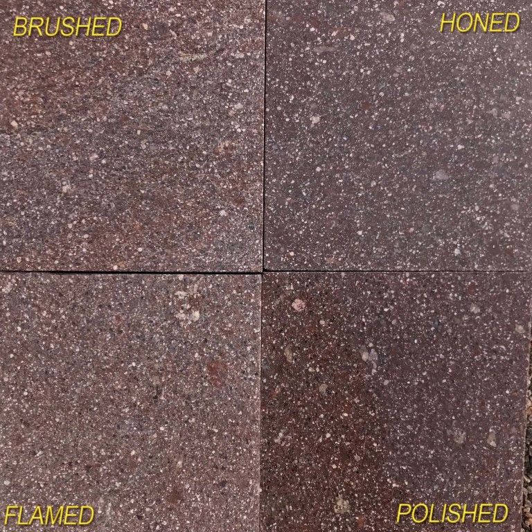 Close-up image for Porphyry Worked Surface - Rosso Antico. The surface finishes shown are brushed, flamed, honed and polished. The dominant color shown is brown; with gray, orange/rust, purple and tan secondaries. The color mix creates a warm feeling. Speckled, coarse speckled and blotched color patterns.