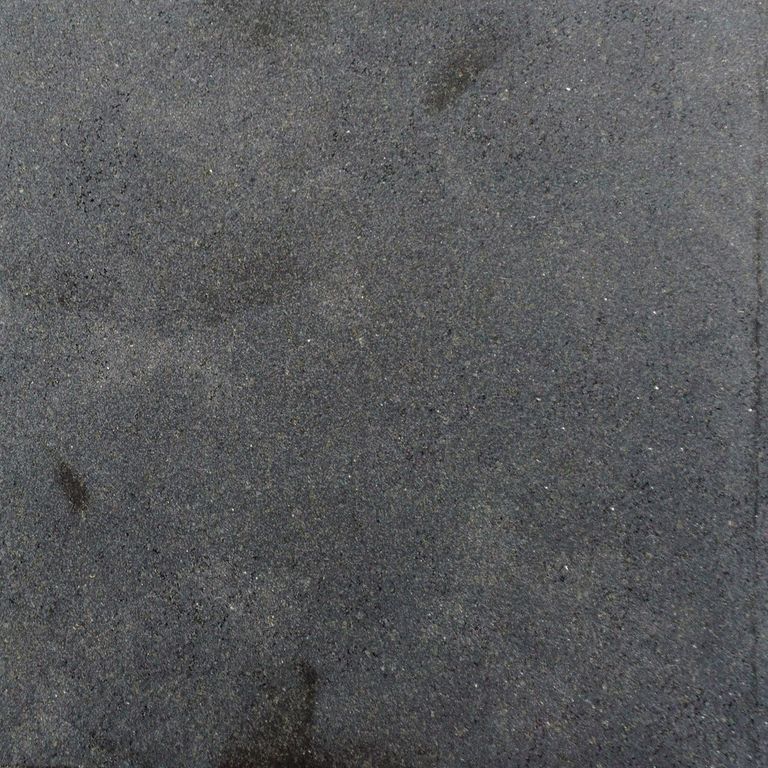 Color/Finish variation image for Ankar Black Basalt. The surface finish shown is honed. Dominant colors shown are black and gray; with black and purple secondaries. Exhibits 