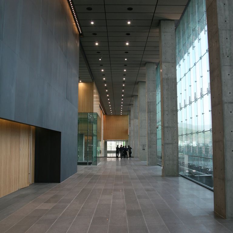 Application image for Basalt - Basaltite. The image shows this material being used in an interior floor application. The surface finish shown is polished. Dominant colors shown are black, gray and purple. The color mix creates a cool feeling. Solid and fine speckled color patterns.