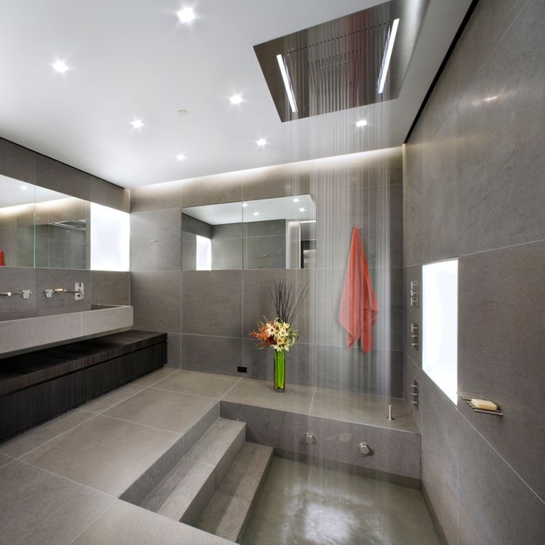 Application image for Basalt - Basaltite. The image shows this material being used for interior floor, sinks, bath tub & shower, thin veneer and interior cladding. The surface finish shown is honed. The dominant color shown is gray. The color mix creates a warm feeling. Solid and regular color patterns.
