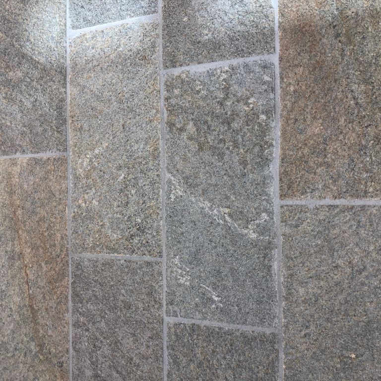 The image shows this material being used in an interior floor application.