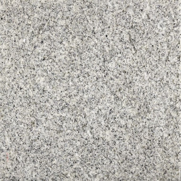 Feature image for Blue Sky Granite. Dominant colors shown are gray and white; with beige and cream secondaries. The color mix creates a cool feeling. Speckled and fine speckled color patterns. Contains some mica and mineral inclusions.