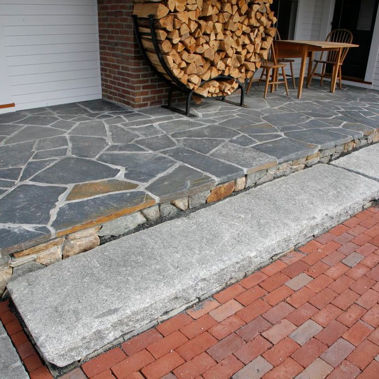 The image shows this material being used in a patio pavers application.