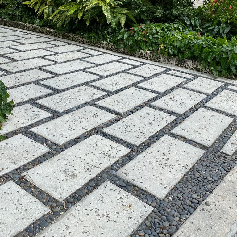 The image shows this material being used in a path pavers application.