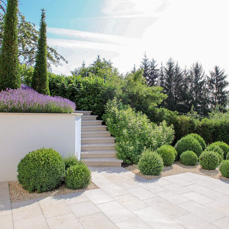 Application image for Bavarian Limestone - Beige. The image shows this material being used for patio pavers and treads. The surface finish shown is honed. The dominant color shown is beige. The color mix creates a warm feeling. Regular color pattern.