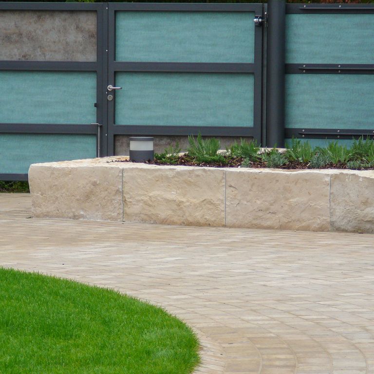 Application image for Bavarian Limestone Gala - Beige. The image shows this material being used in a landscape curbing & edging application. This is a building and landscape stone for outdoor commercial and residential applications. Suitable for general use, low heat absorption surfaces, high traffic areas, low slipperiness surfaces and high heel compatibilty situations. Moderate to higher on the price spectrum.