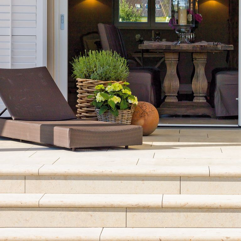 Application image for Bavarian Limestone - Beige. The image shows this material being used for patio pavers and treads. The surface finish shown is honed. Dominant colors shown are beige and cream. The color mix creates a warm feeling. Regular color pattern.