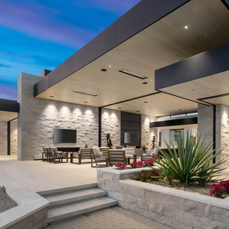 Feature image for Bavarian Gray Limestone. The image shows this material being used for pool coping and pool deck pavers. The dominant color shown is gray. The color mix creates a warm feeling.