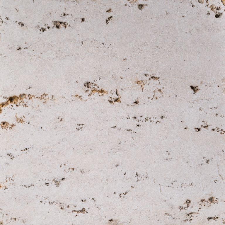 Color/Finish variation image for Bavarian Travertine - Beige. The surface finishes shown are honed and tumbled. Dominant colors shown are beige, gray and white; with brown, pink, purple and cream secondaries. The color mix creates a warm feeling. Random and cloudy color patterns.