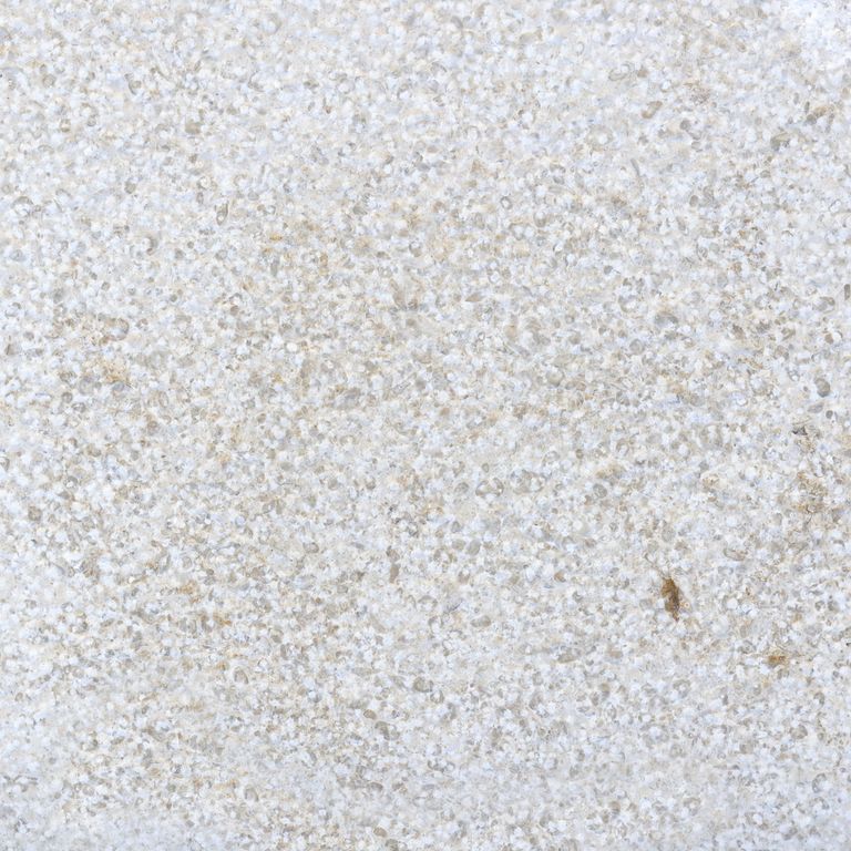 Color/Finish variation image for Sona Beige Limestone. The surface finish shown is bush hammered. Dominant colors shown are gray and white; with beige, pink and cream secondaries. The color mix creates a cool feeling. Coarse speckled and cloudy color patterns.