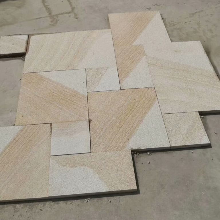 Close-up image for Yangtze Yellow Granite. The surface finishes shown are brushed and coarse bush hammered. Dominant colors shown are beige and gray; with brown, orange/rust, white and tan secondaries. Exhibits 