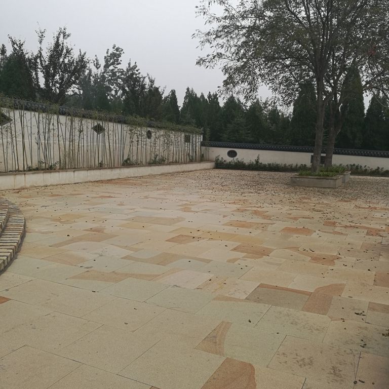 The image shows this material being used in a patio pavers application.