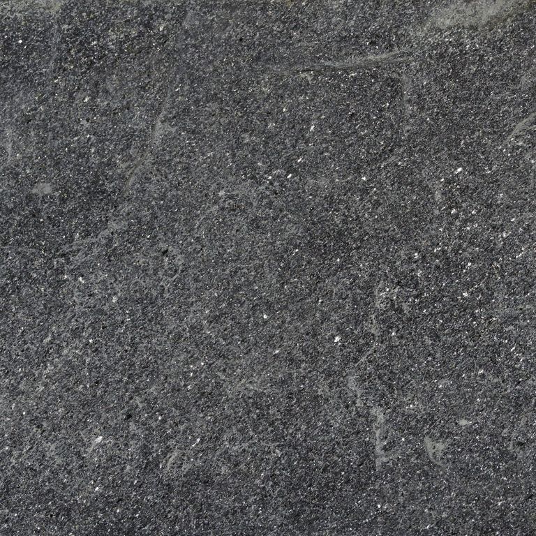 Swatch image cropped for Raven Hill Granite. The surface finish shown is split-face. Dominant colors shown are black and gray; with brown and green secondaries. Exhibits 