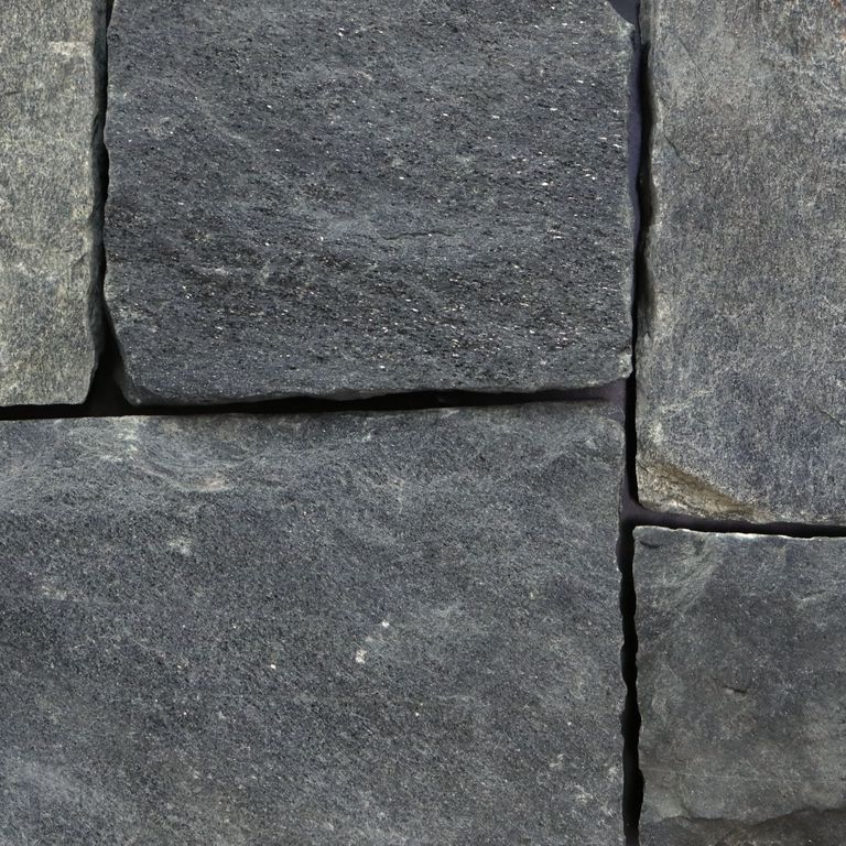Best close-up image for Raven Hill Granite. The image shows this material being used in a thin veneer application. The surface finish shown is . Dominant colors shown are green and gray; with brown, purple and tan secondaries. Regular, blotched and cloudy color patterns. Contains some mica and mineral inclusions.