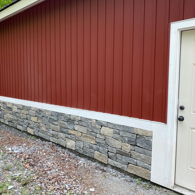 Feature image for Castleton Granite. The image shows this material being used for full bed veneer and thin veneer. The surface finish shown is . Dominant colors shown are beige, brown and gray; with tan and cream secondaries. Exhibits 