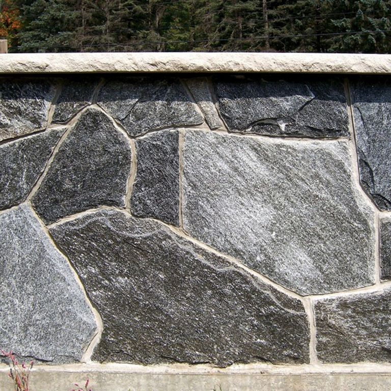 Close-up image for Chester Village Granite Blend. The surface finish shown is split-face with flat plane. The dominant color shown is gray; with beige, black, brown, green, purple, white and cream secondaries. Exhibits 