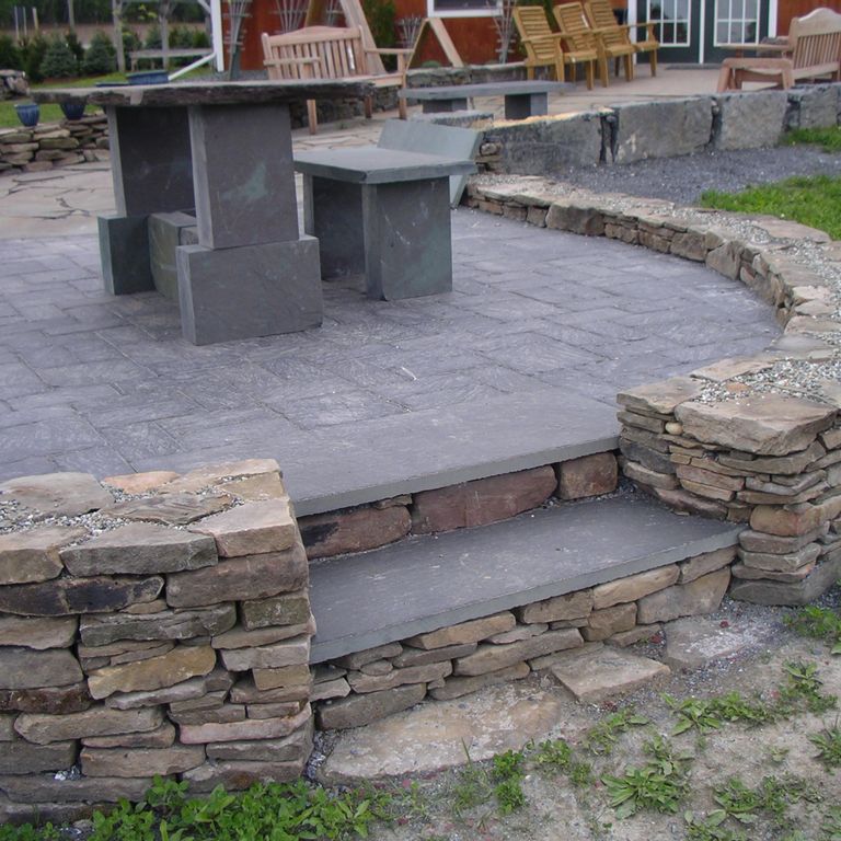The image shows this material being used for patio pavers and treads.