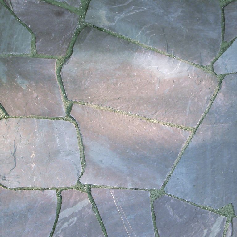 Close-up image for Vermont Slate - Mottled. The surface finish shown is natural cleft. Dominant colors shown are blue, gray and purple; with a green secondary. Exhibits 