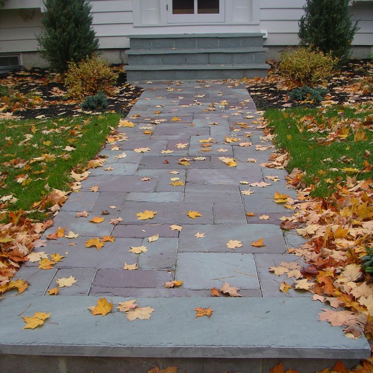 The image shows this material being used in a path pavers application.