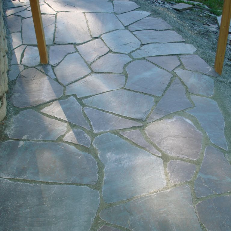 The image shows this material being used for path pavers and patio pavers.