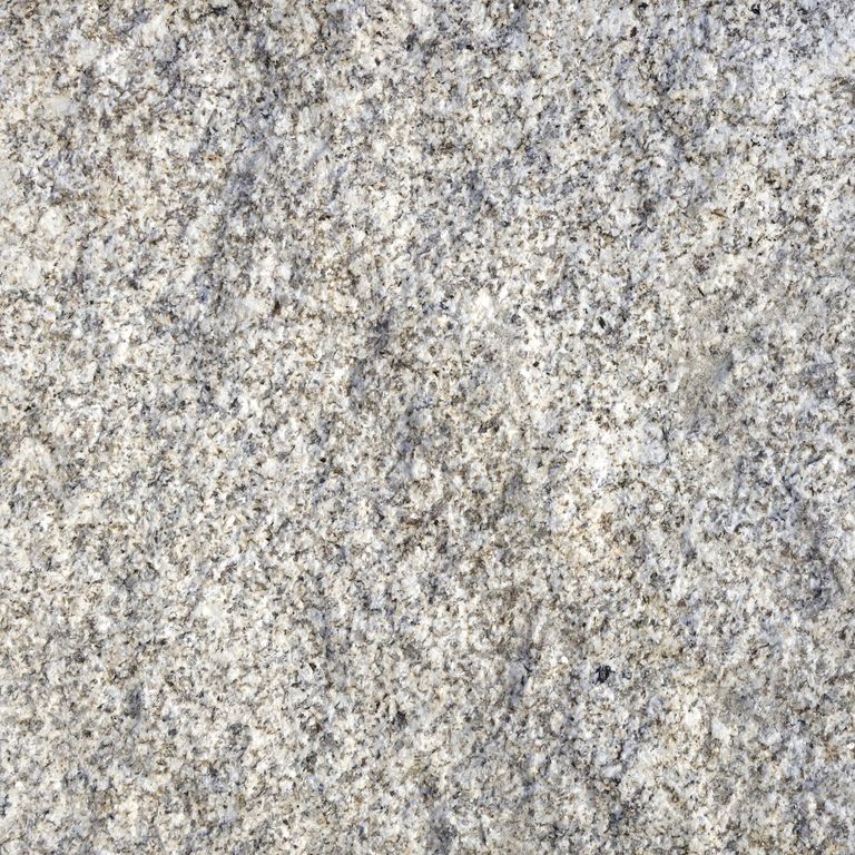 Feature image for Iberian Yellow Granite. Dominant colors shown are beige, gray and white; with a cream secondary. Exhibits 