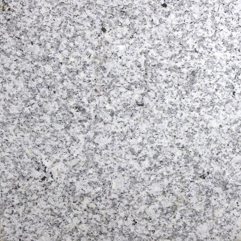 Color/Finish variation image for Iberian Gray Granite. The surface finish shown is sawn. Dominant colors shown are gray and white. The color mix creates a cool feeling. Coarse speckled color pattern.