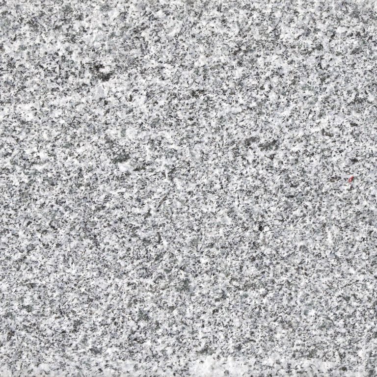Feature image for Iberian Gray Granite. Dominant colors shown are gray and white. The color mix creates a cool feeling. Speckled color pattern. Contains some mica and mineral inclusions.