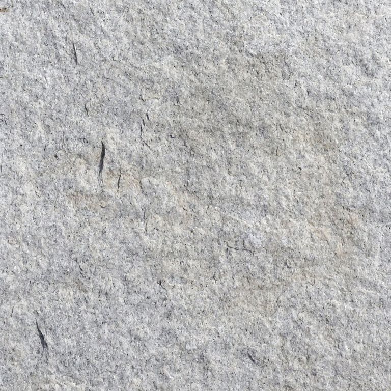 Color/Finish variation image for Granite Pavers - Square - Gray. The surface finishes shown are flamed and split-face with flat plane. Dominant colors shown are gray and white; with a beige secondary. The color mix creates a cool feeling. Fine speckled and cloudy color patterns.