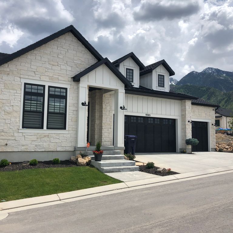 Application image for Blanco Limestone. The image shows this material being used for full bed veneer and thin veneer. The surface finish shown is split-face. The dominant color shown is white; with a cream secondary. The color mix creates a warm feeling. Solid color pattern.