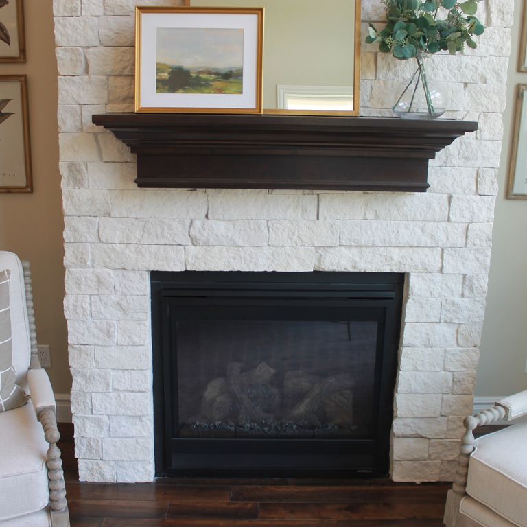 Application image for Limestone - Blanco. The image shows this material being used for fireplace surround, full bed veneer, thin veneer and interior cladding. The surface finish shown is split-face. The dominant color shown is white; with a cream secondary. The color mix creates a warm feeling. Solid color pattern.