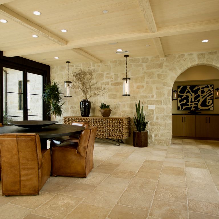 Application image for Limestone - Honey Buff. The image shows this material being used for full bed veneer, thin veneer and interior cladding. Dominant colors shown are brown and tan; with beige and orange/rust secondaries. Regular color pattern.
