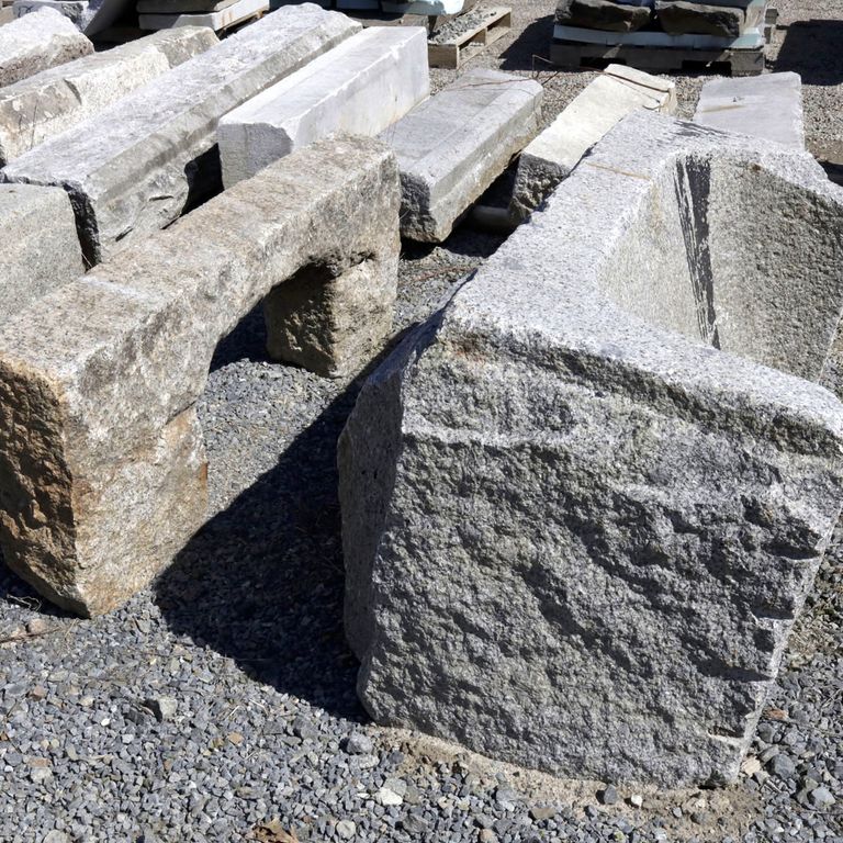 Close-up image for Reclaimed Historic Streetscape Stones. The surface finishes shown are weathered and worn. The dominant color shown is gray; with beige, brown, white and cream secondaries. Speckled color pattern.