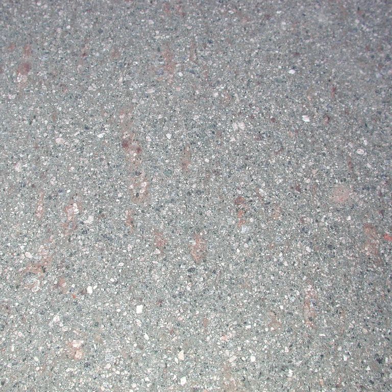 Swatch image cropped for Porphyry Worked Surface - Gray Imperial Roman. The surface finish shown is flamed. The dominant color shown is gray; with blue, pink and white secondaries. The color mix creates a cool feeling. Speckled color pattern.