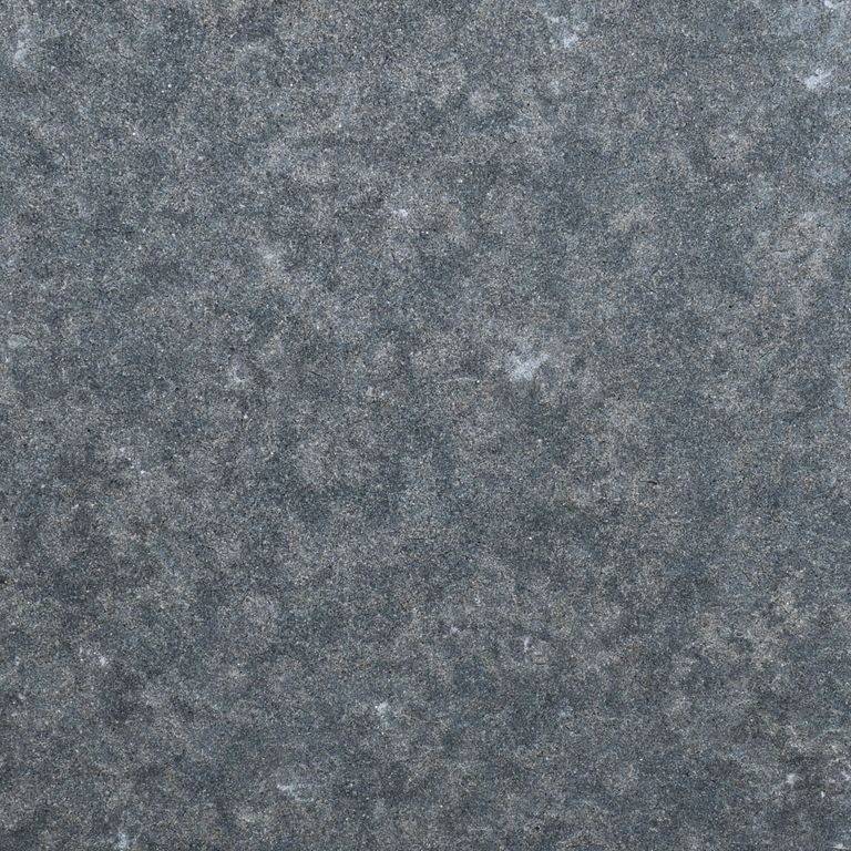 Color/Finish variation image for Polar Gray Limestone. The surface finish shown is flamed. The dominant color shown is gray. The color mix creates a cool feeling.