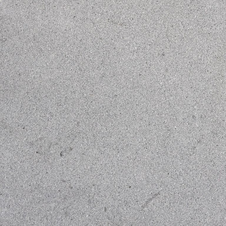 Color/Finish variation image for Polar Gray Limestone. The surface finish shown is sand blasted. The dominant color shown is gray. The color mix creates a cool feeling. Fine speckled and cloudy color patterns.