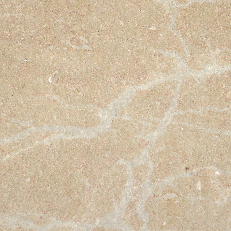 Color/Finish variation image for Cenia Beige Dolomitic Limestone. The surface finish shown is flamed. Dominant colors shown are beige and tan; with brown, orange/rust and cream secondaries. Exhibits 