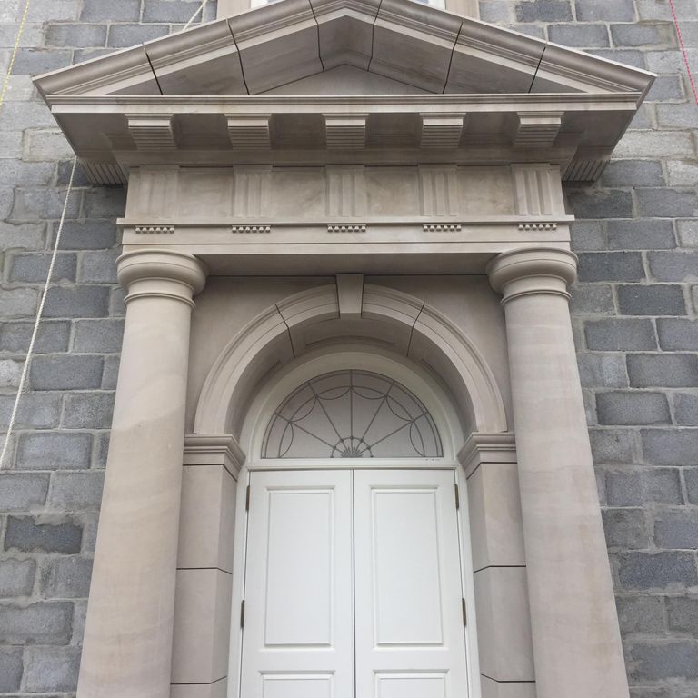 Feature image for Limestone - Spanish Amalfi. The image shows this material being used for full bed veneer and thin veneer. The surface finish shown is carved. Dominant colors shown are beige, blue and gray; with white, tan and cream secondaries. Exhibits 