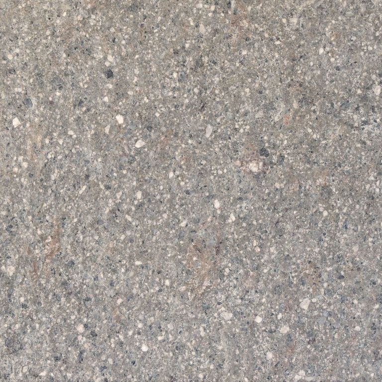 Close-up image for Imperial Roman Porphyry - Gray. The surface finishes shown are brushed and flamed. The dominant color shown is gray; with beige, blue, green, orange/rust, purple, white, tan and cream secondaries. Speckled and coarse speckled color patterns. Contains mineral inclusions.