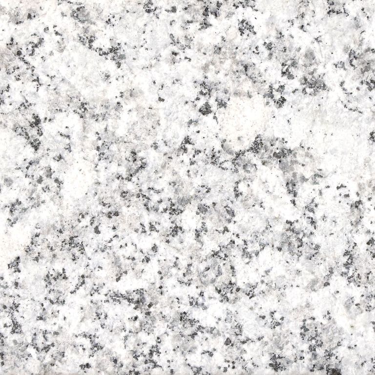 Color/Finish variation image for Gray Ice Granite. The surface finish shown is sand blasted. Dominant colors shown are gray and white. The color mix creates a cool feeling. Speckled and blotched color patterns.