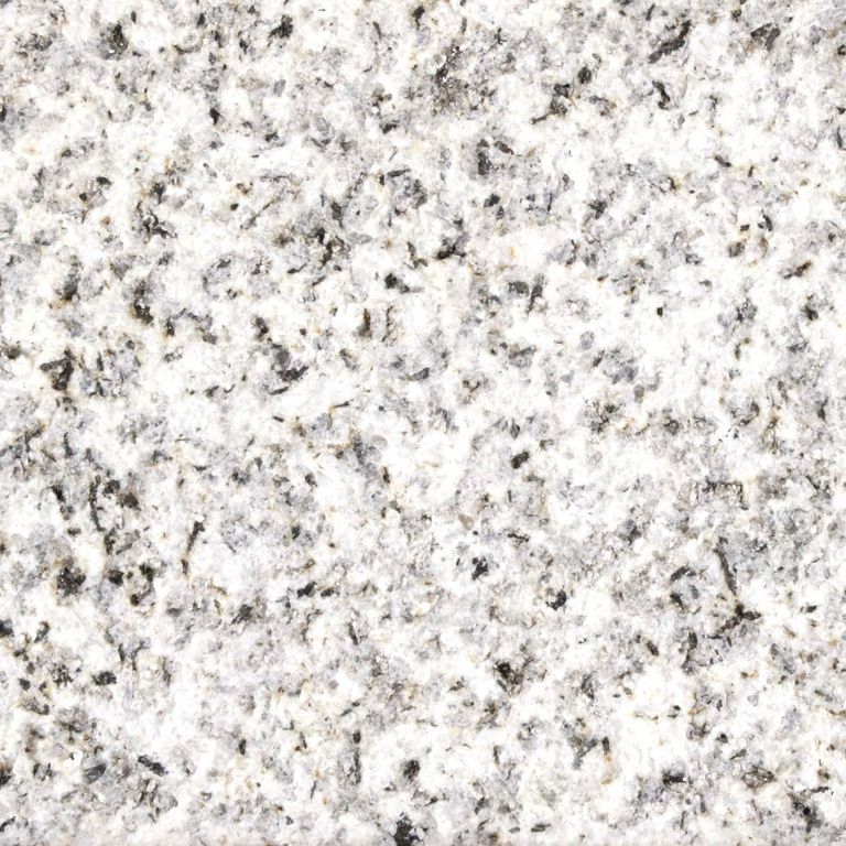 Close-up image for Crystal White Granite. The surface finish shown is sand blasted. Dominant colors shown are gray, white and cream; with beige and pink secondaries. Coarse speckled color pattern. Contains some mica and mineral inclusions.