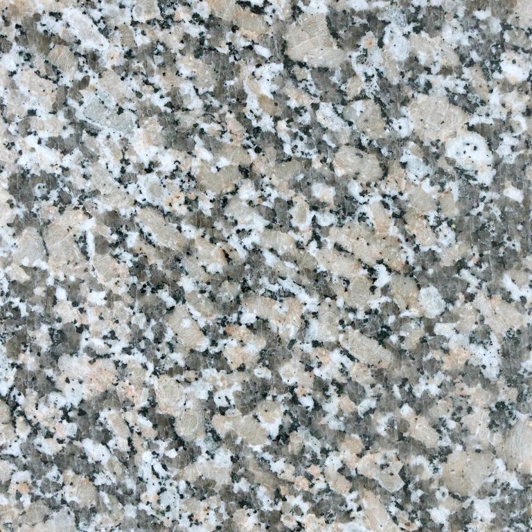 Color/Finish variation image for Lapa Gray Granite. The surface finish shown is polished. The dominant color shown is gray. The color mix creates a cool feeling. Coarse speckled color pattern.