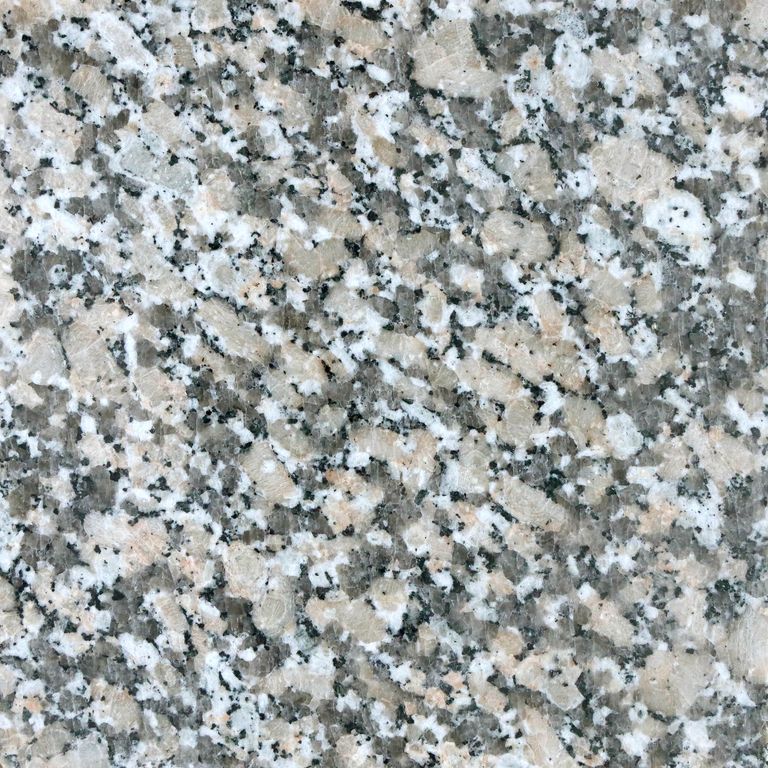 Feature image for Lapa Gray Granite. The surface finish shown is polished. Dominant colors shown are beige, gray, white and cream; with pink and purple secondaries. The color mix creates a cool feeling. Coarse speckled color pattern. Contains some mica and mineral inclusions.