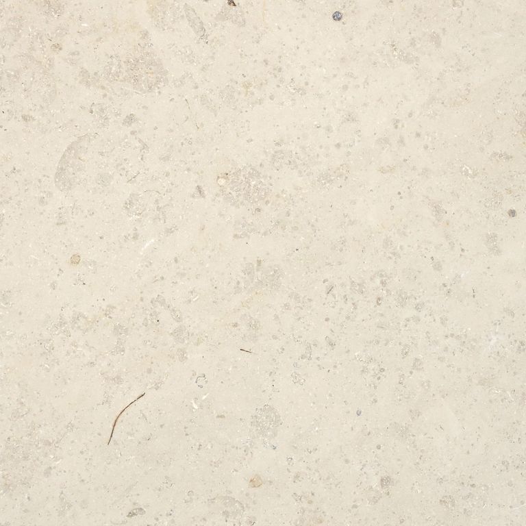 Close-up image for Bavarian Limestone Venezia - Beige. The surface finish shown is honed. Dominant colors shown are beige, tan and cream; with a white secondary. The color mix creates a warm feeling. Regular and cloudy color patterns. Contains mineral inclusions.