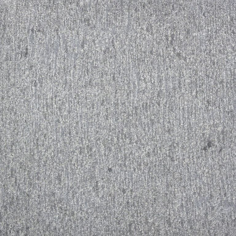 Color/Finish variation image for Sugus Bluestone. The surface finish shown is adze. The dominant color shown is gray; with blue and white secondaries. The color mix creates a cool feeling. Speckled color pattern.