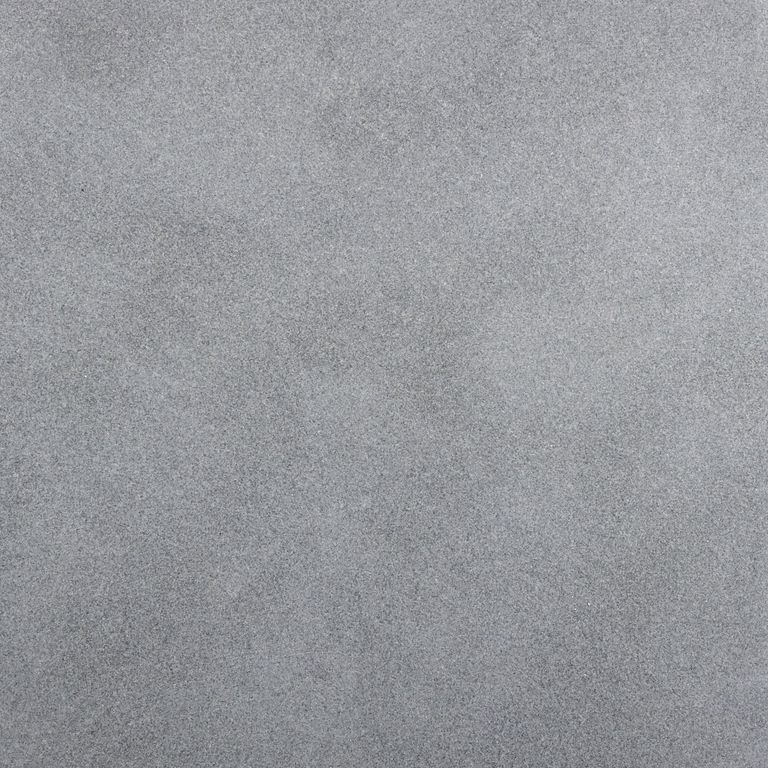 Color/Finish variation image for Sugus Bluestone. The surface finish shown is honed. The dominant color shown is gray; with blue and white secondaries. The color mix creates a cool feeling. Solid, fine speckled and cloudy color patterns.