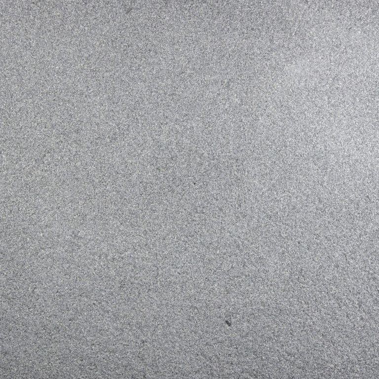 Color/Finish variation image for Sugus Bluestone. The surface finish shown is sand blasted. The dominant color shown is gray; with a white secondary. The color mix creates a cool feeling. Solid and fine speckled color patterns.