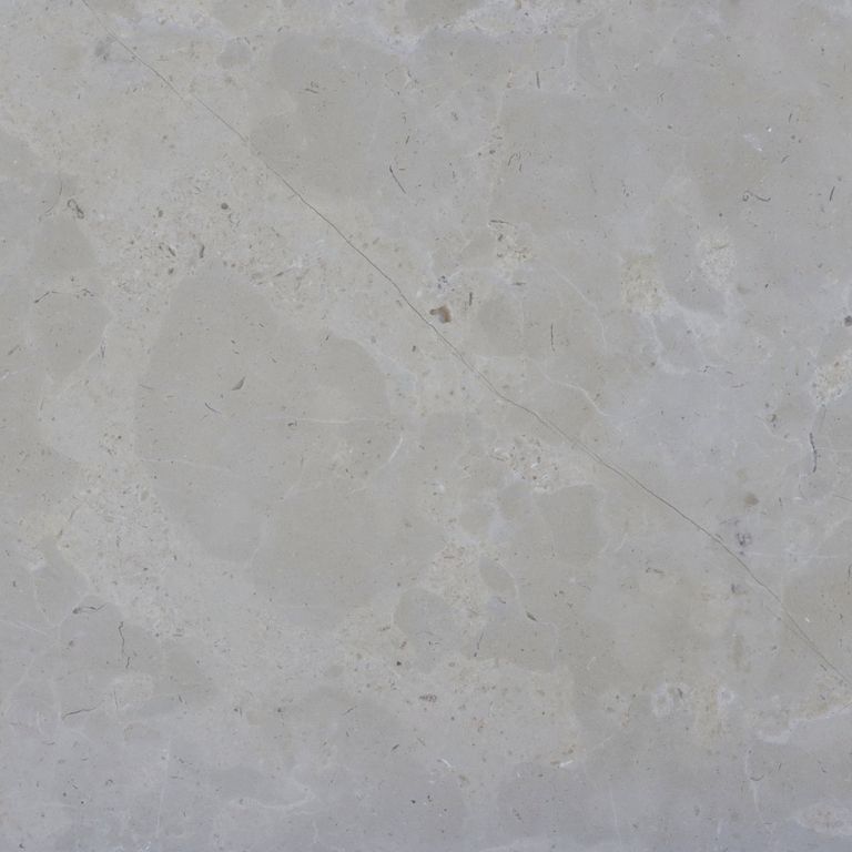 Color/Finish variation image for Estrema Light Limestone. The surface finish shown is brushed. The dominant color shown is gray. Exhibits 