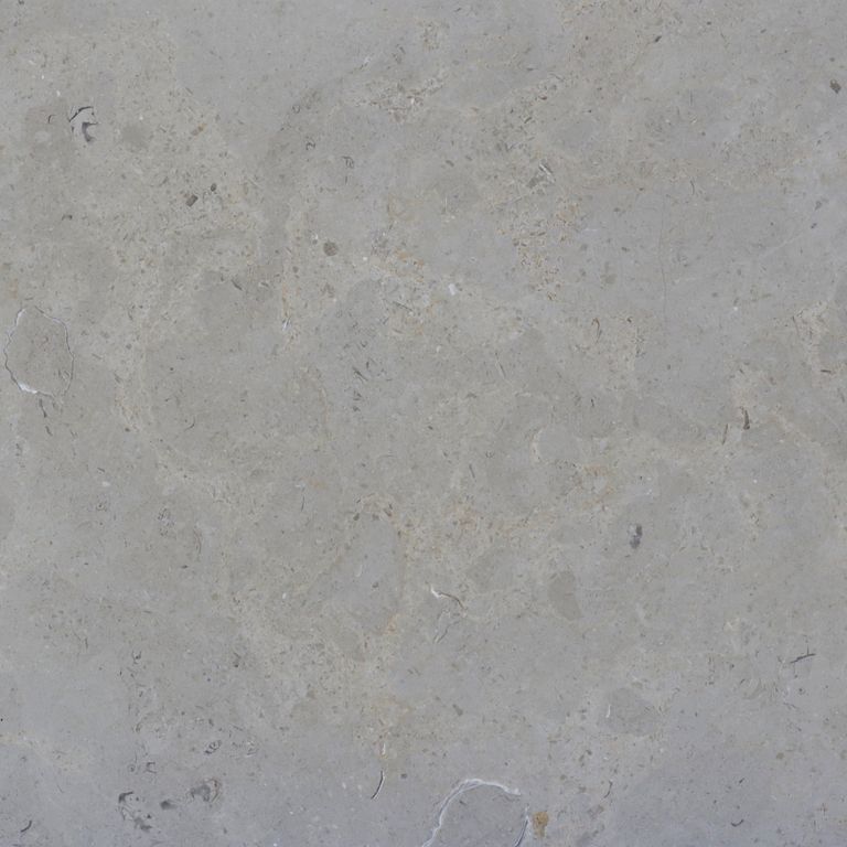 Color/Finish variation image for Estrema Light Limestone. The surface finish shown is honed. The dominant color shown is gray. Exhibits 